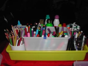 Use a cleaning caddy to hold art supplies