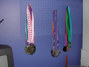 Use a peg board to hang jewellery or medals