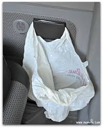 A plastic garbage bag can be hooked on armrests.