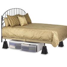 Bed Raisers are palce under each bed post to raise the bed