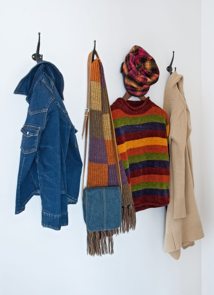 Colorful clothing on coat hooks