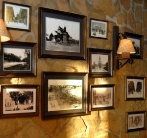 Pictures in frames hanging on an old wall