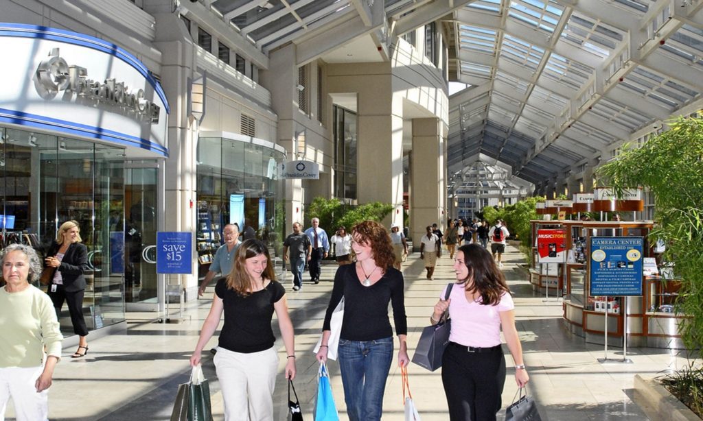 Three ladies shopping in a shopping mall