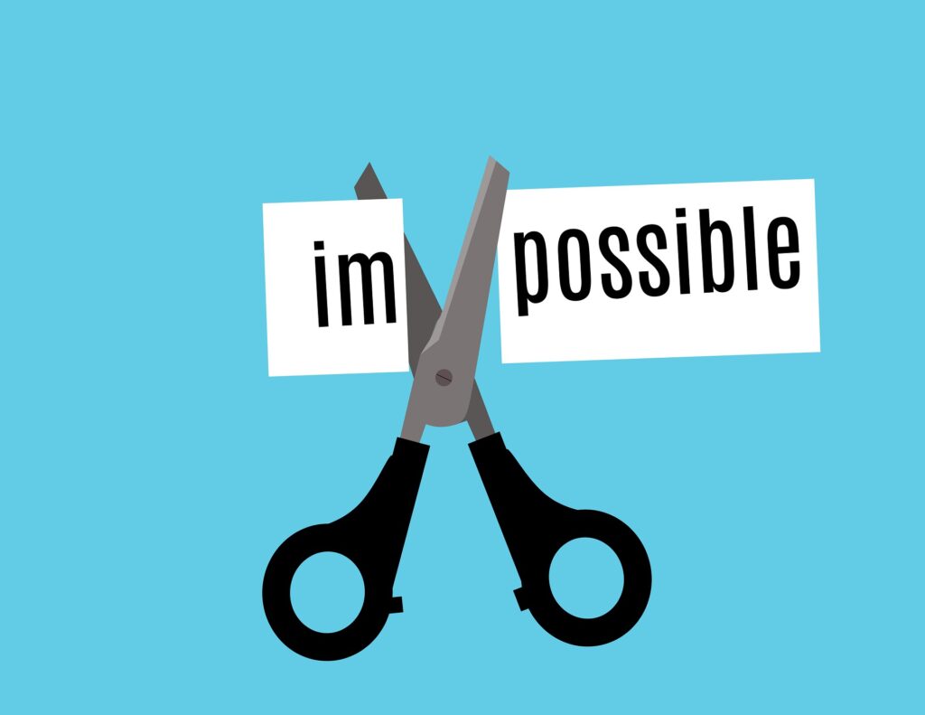 the word impossible on a blue background with a scissor cutting off im to make the word say possible.