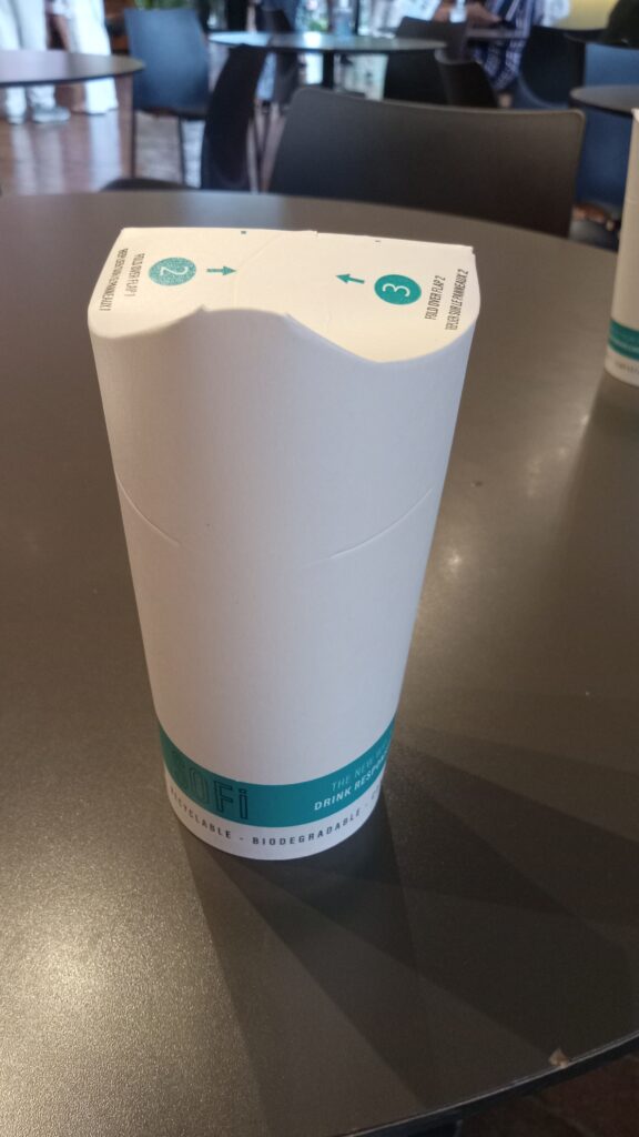 A paper cup that is folded to make a spout