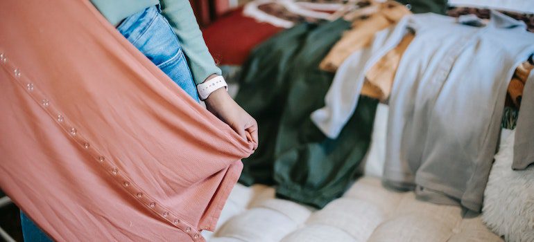 A person looking at some clothes.