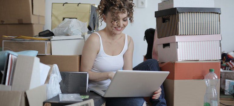 Woman surrounded by her belongings