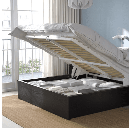 Ikea bed with a mattress that lifts to have a storage space.