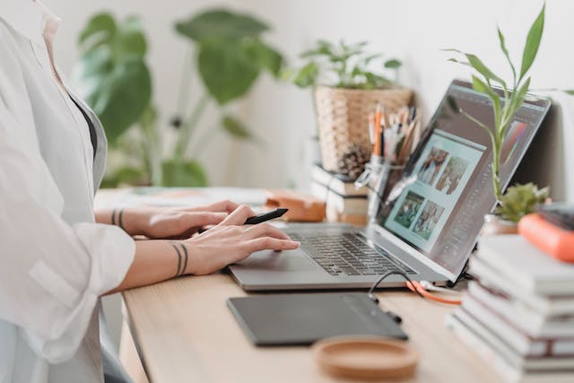 A woman works on a laptop