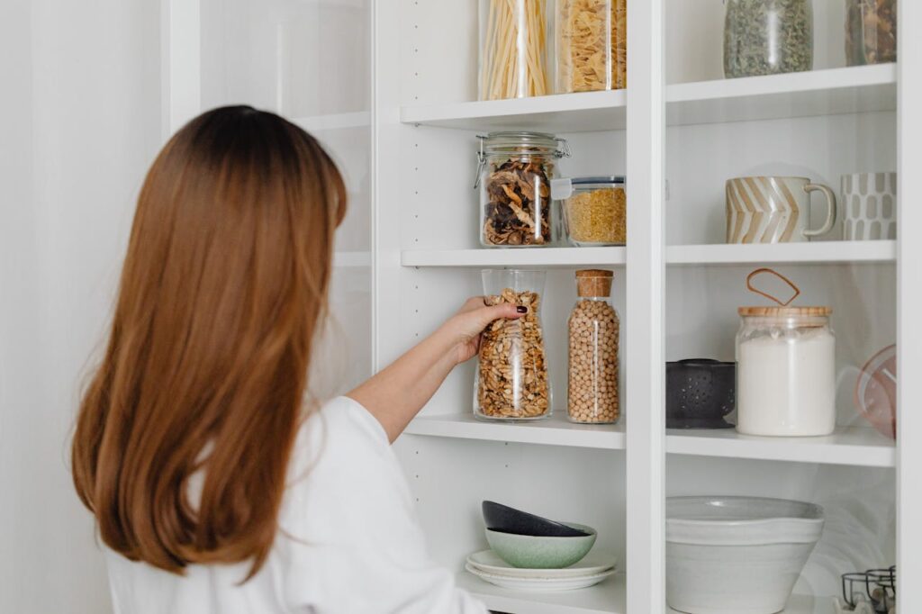 A woman organizing things on a shelf