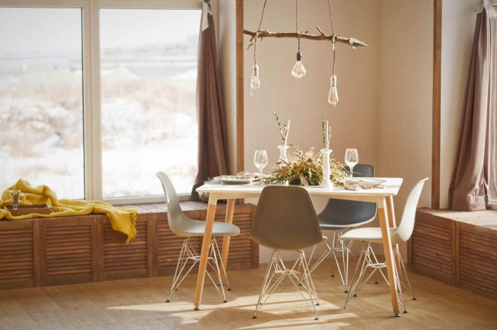 A nicely decorated and organized table with chairs