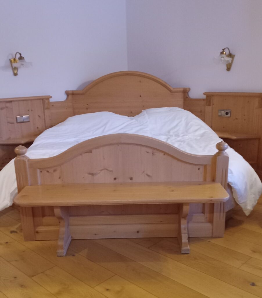 Pine bedroom set with a footboard that is also a bench.