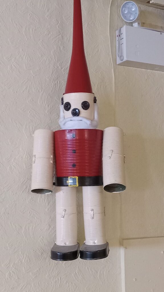 A Santa made out of sardine tins, soup cans and other tin cans. 
