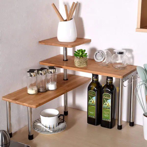 3 Wooden shelves that sit at 90 degrees to each other and fit in a corner on a counter.